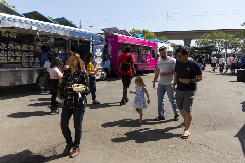 EL SEGUNDO, September 20, 2019: Food trucks lined up at the L.A. Street Festival in El Segundo on Friday, September 20, 2019. (Allison Zaucha / For The Times)