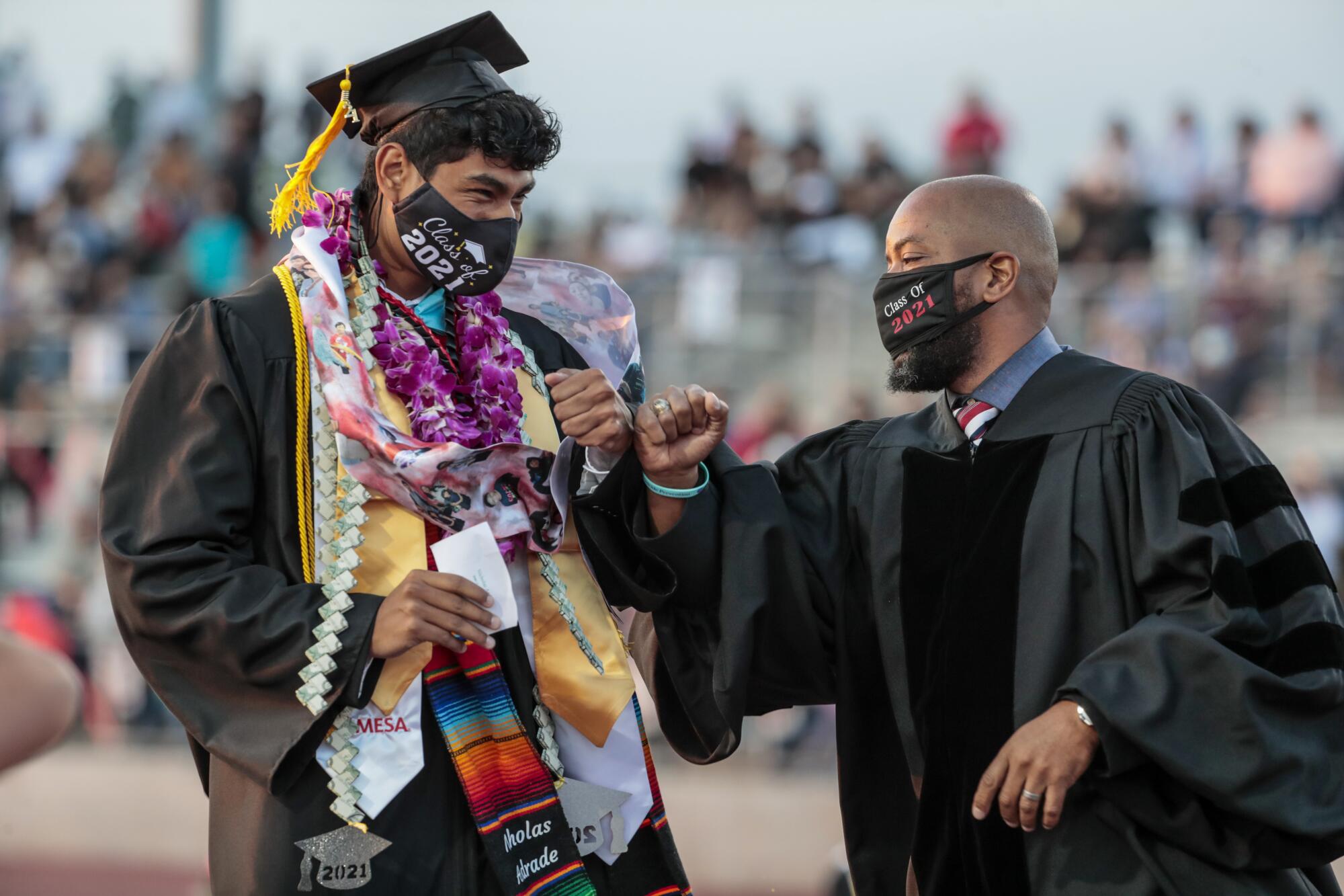 Sierra Vista Principal Vince Pratt fist bumps a graduate