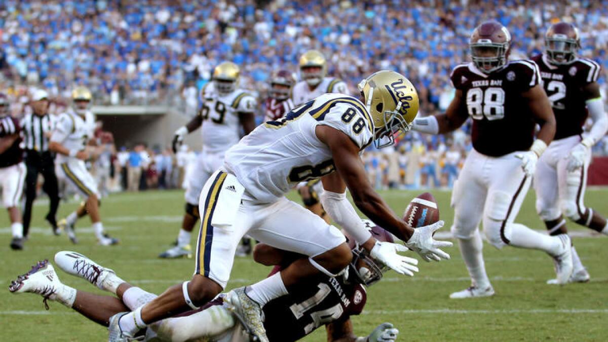 UCLA tight end Austin Roberts bobbles a potential touchdown pass at the goal line during the Bruins' overtime loss to Texas A&M a year ago.