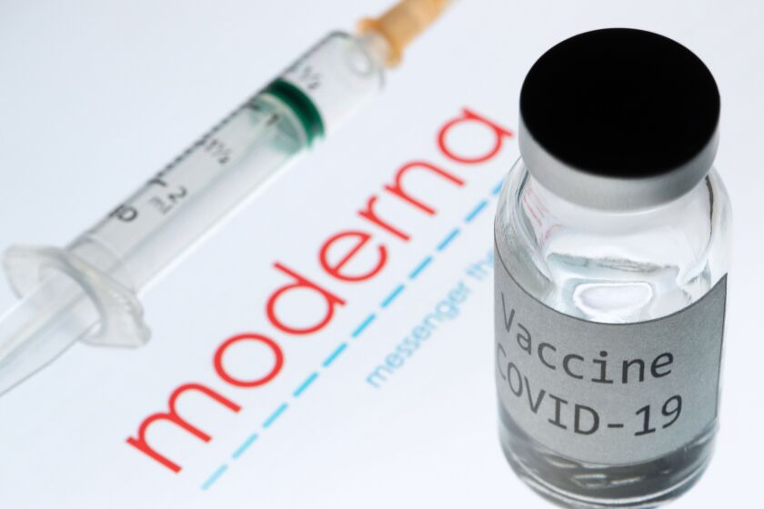 This picture taken on November 18, 2020 shows a syringe and a bottle reading "Vaccine Covid-19" next to the Moderna biotech company logo. - The CEO of Moderna warned European countries on November 17 that dragging out negotiations to purchase its promising new Covid-19 vaccine will slow down deliveries, as other nations that have signed deals will get priority. The biotech company Pfizer said the day after that a completed study of its experimental Covid-19 vaccine showed it is 95 percent effective, after Moderna said its own vaccine was 94.5 percent effective, according to a preliminary analysis. (Photo by JOEL SAGET / AFP) / -- IMAGE RESTRICTED TO EDITORIAL USE - STRICTLY NO COMMERCIAL USE -- (Photo by JOEL SAGET/AFP via Getty Images)