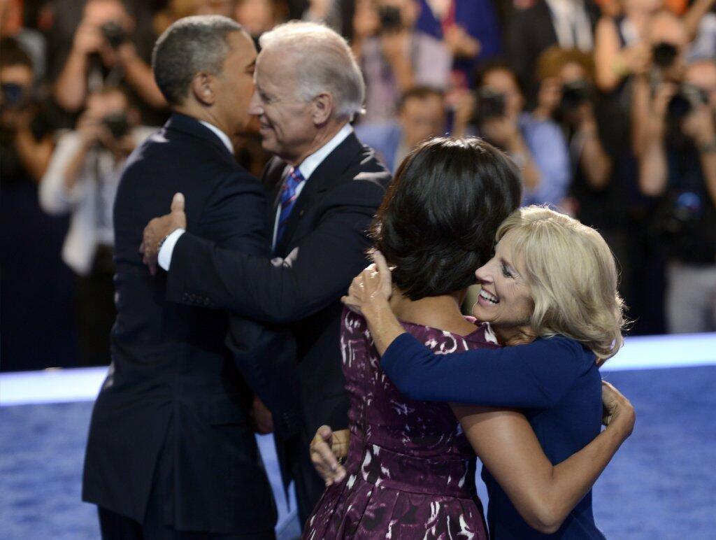 The double hug, convention style. President Obama and Vice President Biden in the man-hug moment, while their wives, Michelle Obama and Jill Biden, do the lady version on Sept. 6. It's like the who-sits-where-in-the-car-on-a-double-date dilemma: Is it the women sitting together in the back while the guys sit in front? Or the couple who owns the car in the front seat, the guest couple in the back? Or, daringly, both women sit in the front, both men in the back? Those are very secure men ... ALSO: PHOTOS: Joe Biden wants to hug ... everyone!