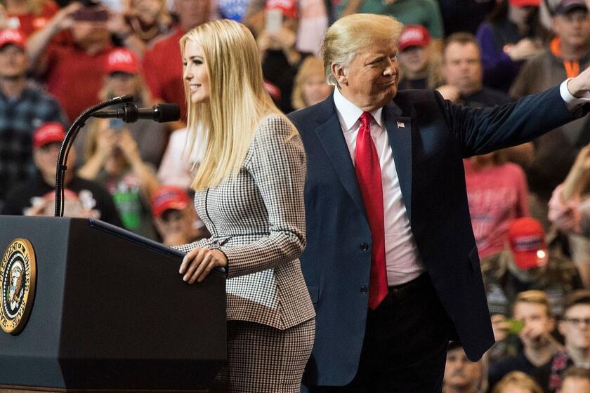 US President Donald Trump gestures as his daughter Ivanka Trump speaks at a Make America Great Again rally in Cleveland, Ohio on November 5, 2018. (Photo by Jim WATSON / AFP)JIM WATSON/AFP/Getty Images ** OUTS - ELSENT, FPG, CM - OUTS * NM, PH, VA if sourced by CT, LA or MoD **