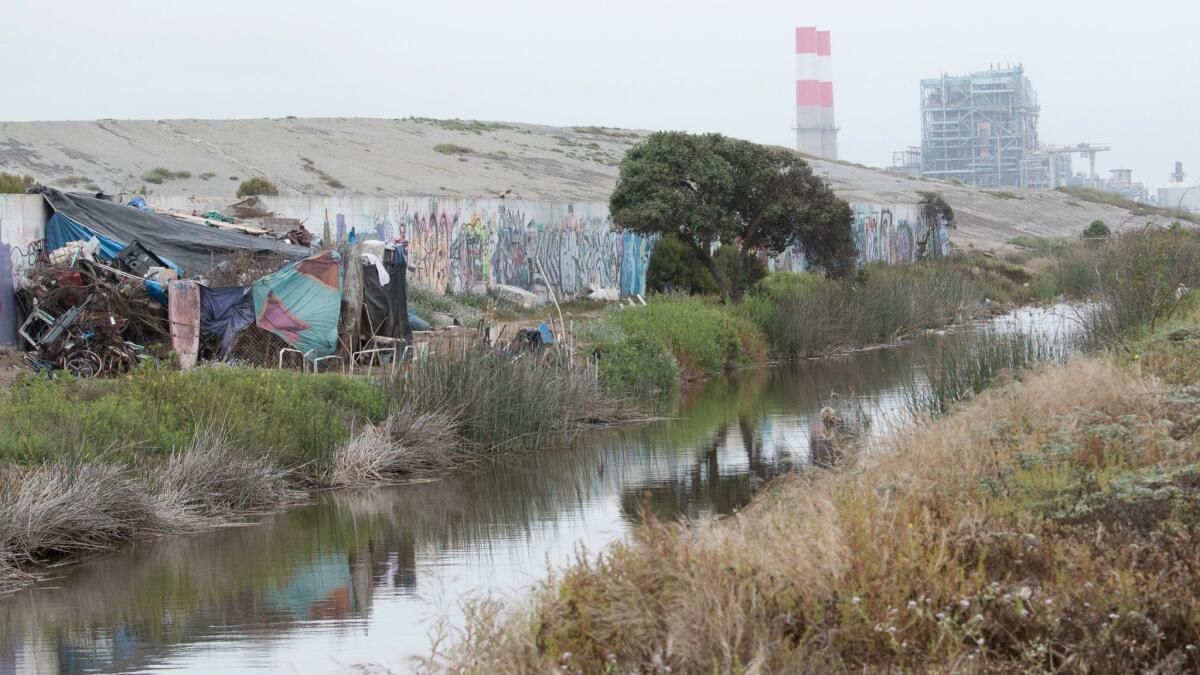 The Ormond Beach generating station is visible behind the former Halaco Engineering Company site that is now a Superfund site at the Ormond Beach wetlands in Oxnard.