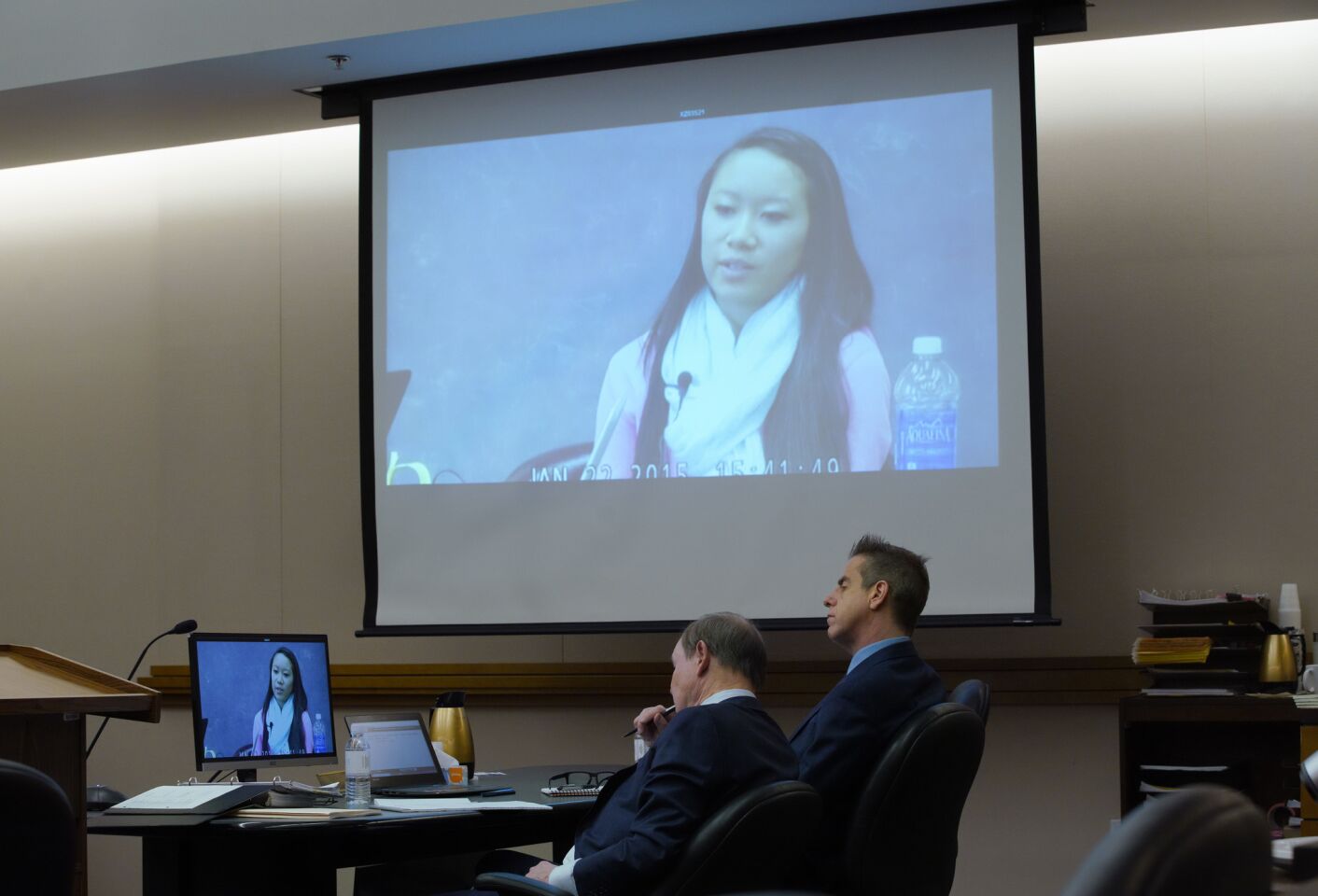 Adam Shacknai (right) sits next to his attorney, Dan Webb as a video is played of Rebecca Zahau's younger sister Xena Zahau taken during her January 22, 2015 deposition.