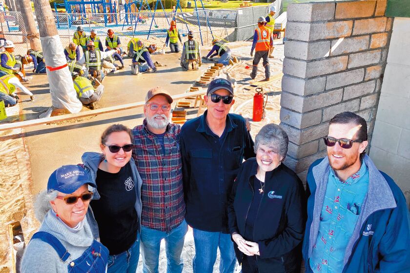 Project artist Robin Brailsford, art assistant Mariah Conner, project artist Wick Alexander, Grunow Construction project manager Bill Anderson, Mary Coakley-Munk and Shaw & Sons Concrete rep Jeff Counterman pose February 2020 at the sight of The Map installation in La Jolla Shores.