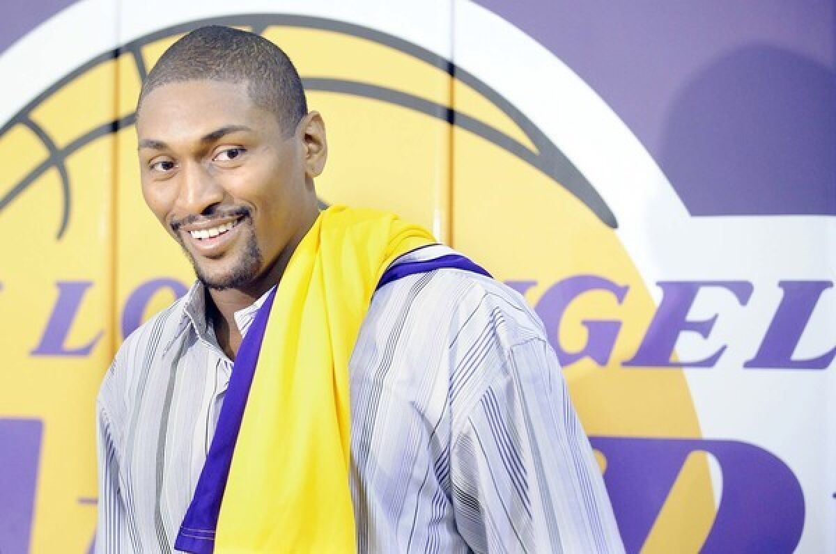 Ron Artest arrives for his introductory news conference with the Lakers.