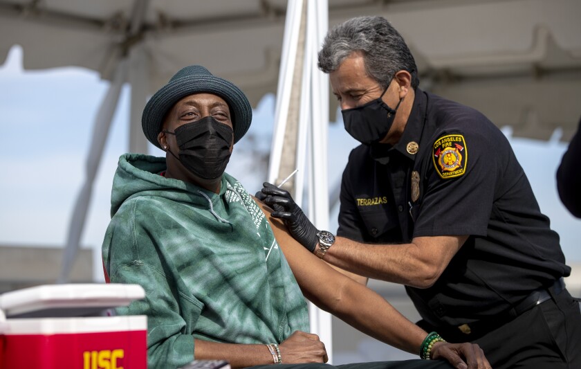Arsenio Hall gets a COVID-19 vaccine.