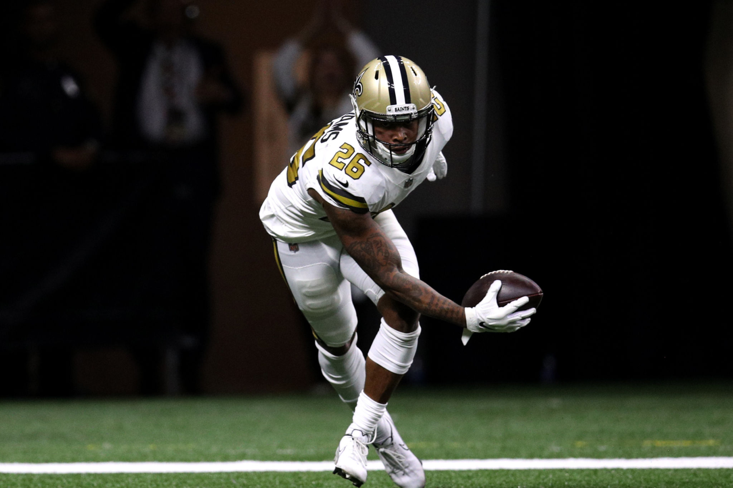 New Orleans Saints safety P.J. Williams intercepts a pass thrown by Tampa Bay Buccaneers quarterback Tom Brady.