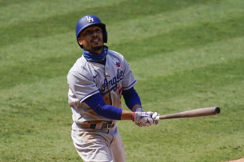 Los Angeles Dodgers' Mookie Betts hits a foul ball during a baseball game against the Los Angeles Angels Sunday, Aug. 16, 2020, in Anaheim, Calif. (AP Photo/Marcio Jose Sanchez)