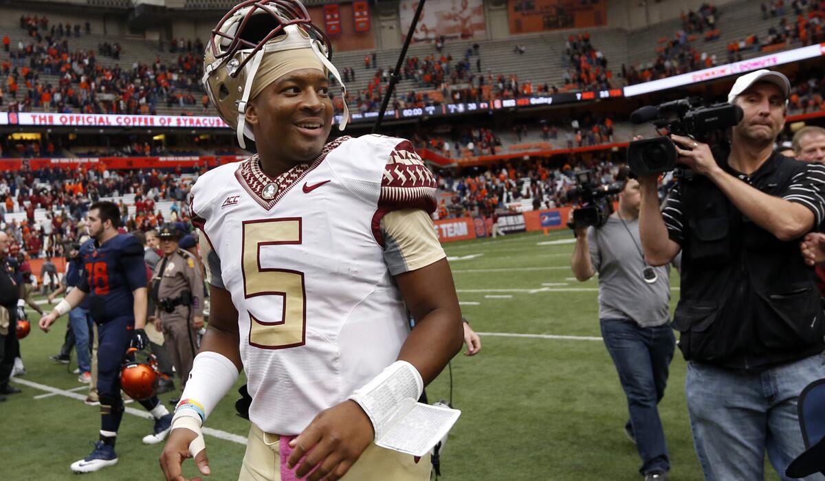 Florida State quarterback Jameis Winston is all smiles after the Seminoles' 38-20 victory at Syracuse on Saturday.