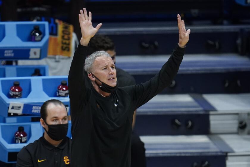 USC head coach Andy Enfield watches against Kansas during the second half of a men's college basketball game in the second round of the NCAA tournament at Hinkle Fieldhouse in Indianapolis, Monday, March 22, 2021. (AP Photo/Paul Sancya)