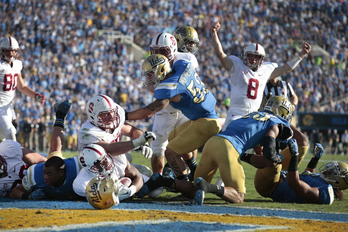Stanford running back Remound Wright crosses into the end zone on a two-yard carry in the third quarter of the Bruins' 31-10 loss to the Cardinal in 2014.
