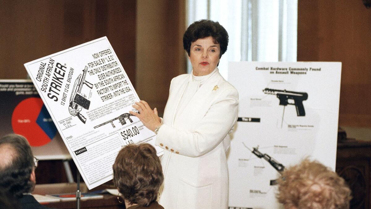 Sen. Dianne Feinstein (D-Calif.) holds up an advertisement for a Striker shotgun during a 1994 news conference in Washington to discuss her proposed restrictions on assault weapons.