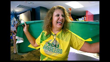 A local fan waves the Brazilian flag as Brazil plays Serbia during third game of World Cup group round, at Gauchos Village Brazilian restaurant, in Glendale on Wednesday, June 27, 2018. Brazil won 2-0 and advances to the round of 16 and will play Mexico on Monday.