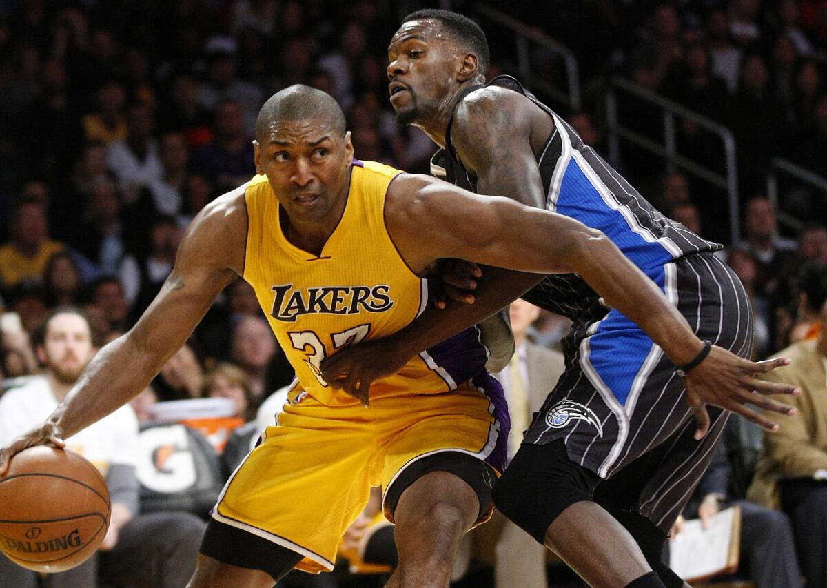 Lakers forward Metta World Peace drives around Orlando Magic center Dewayne Dedmon on March 8 at Staples Center.