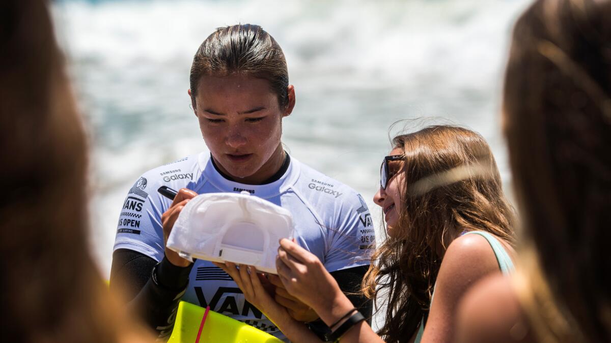 Meah Collins autographs and greets fans at the US Open of Surfing in Huntington Beach.