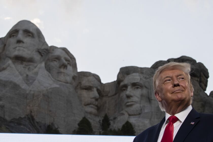 President Donald Trump smiles at Mount Rushmore National Memorial, Friday, July 3, 2020, near Keystone, S.D. (AP Photo/Alex Brandon)