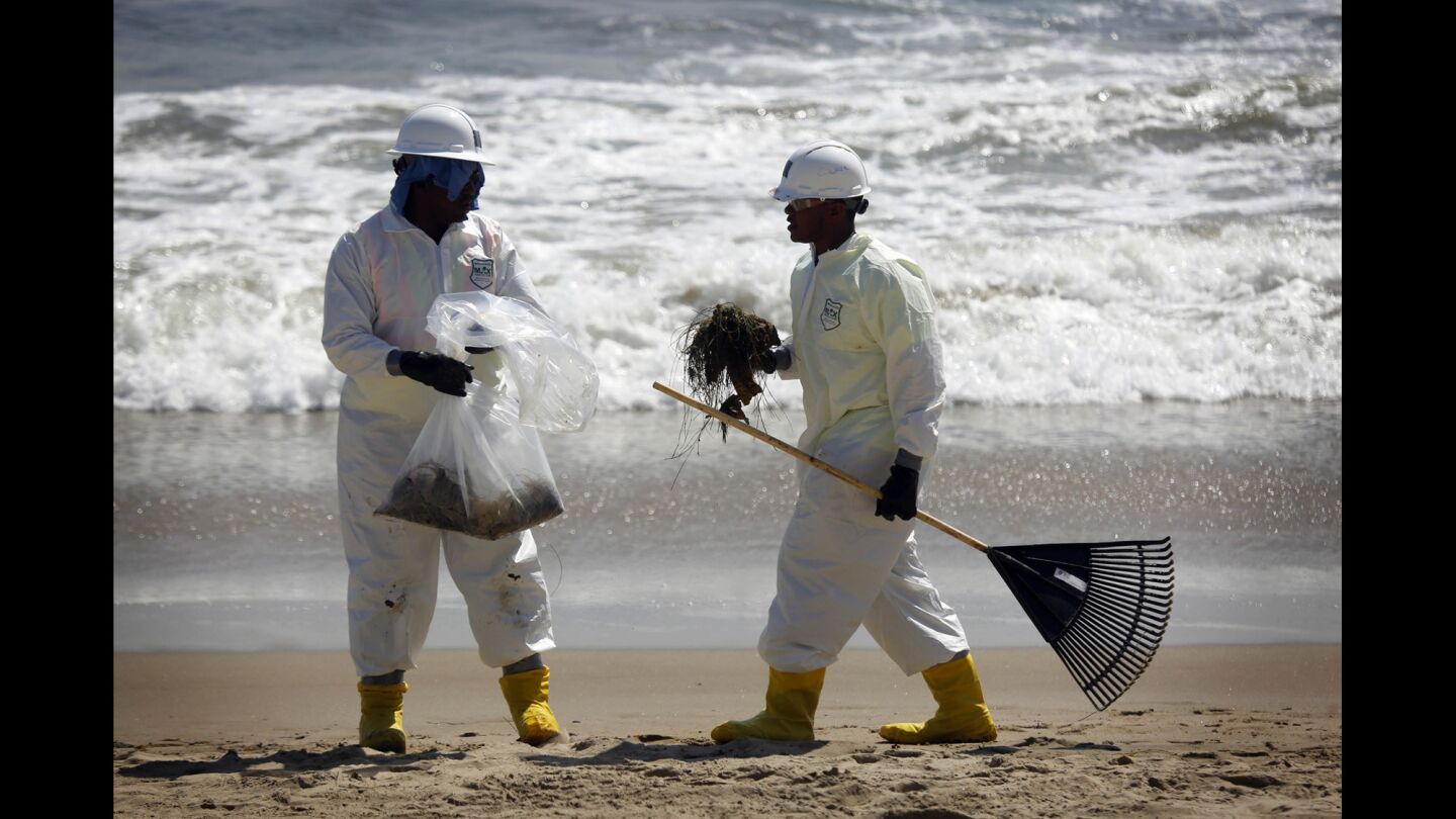Crews work to clean the crude-stained coastline at El Capitan State Beach. Authorities have intensified their response to the Santa Barbara oil spill by announcing remedies and additional investigations.