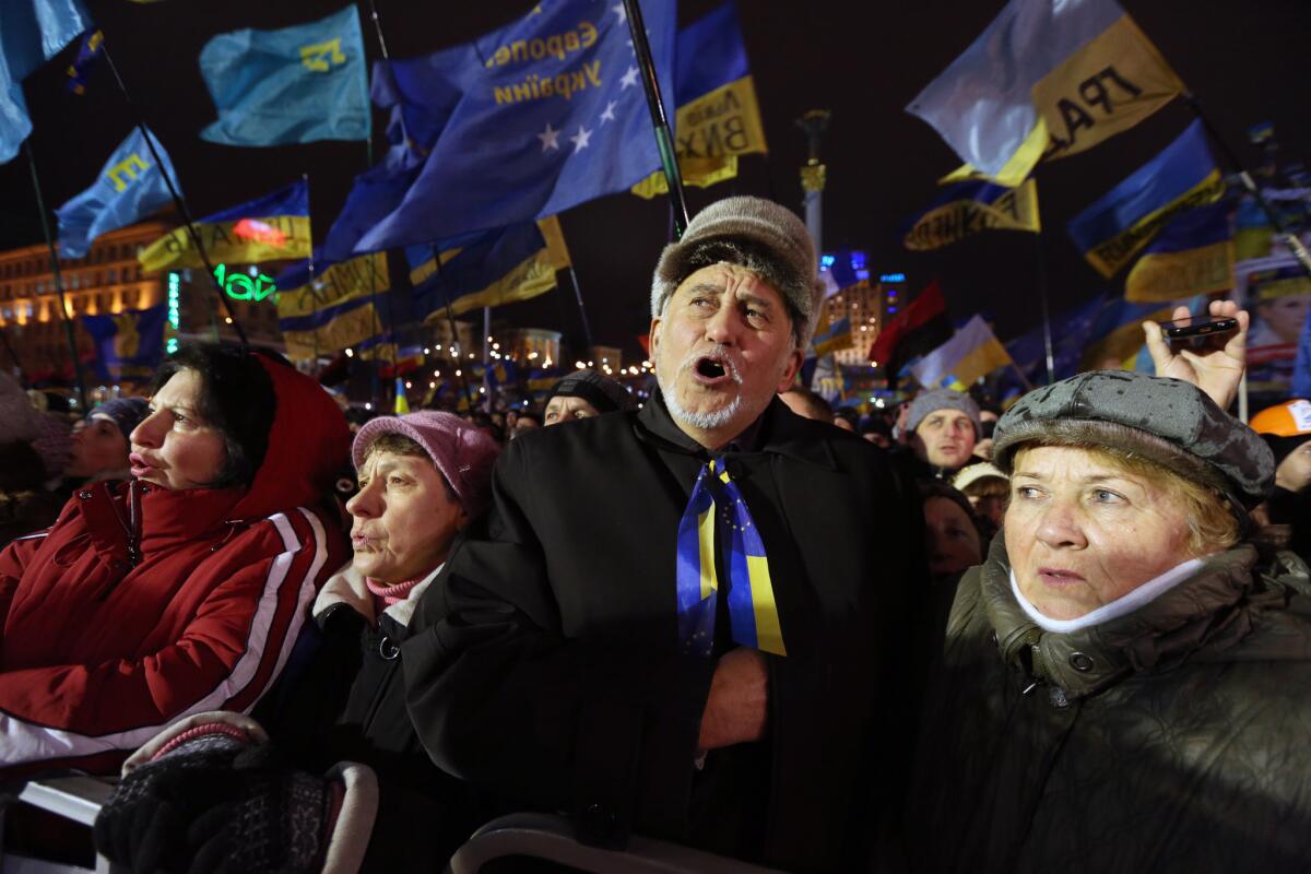 Thousands of protesters in Kiev's Independence Square on Tuesday demanded President Viktor Yanukovich's resignation upon hearing news of an agreement with Russia.