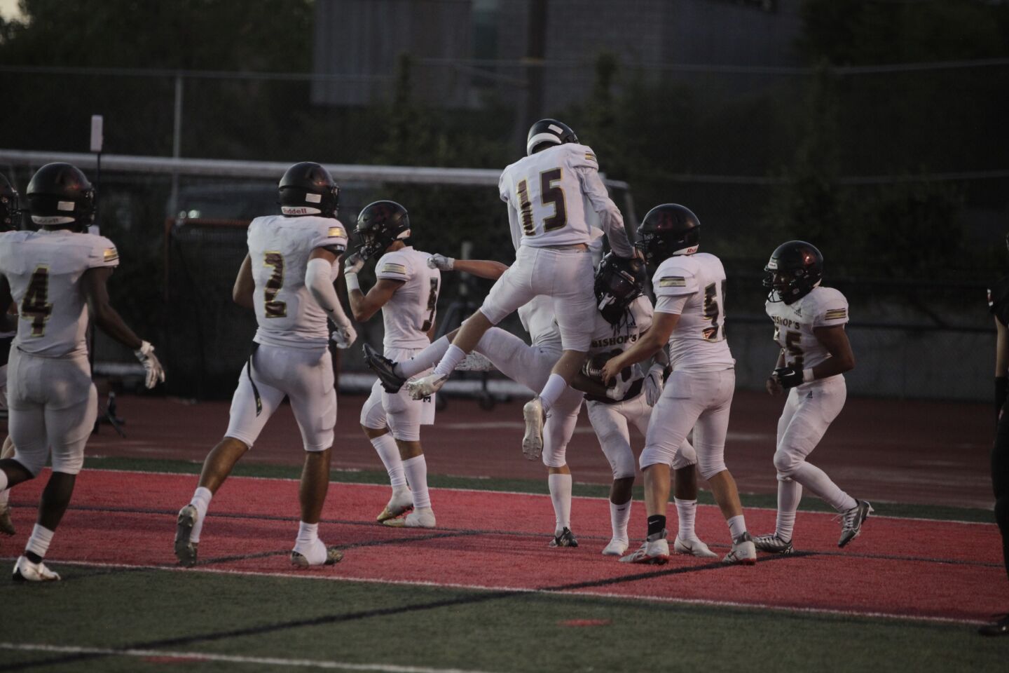 The Bishop's Knights celebrate one of their four touchdowns of the night.