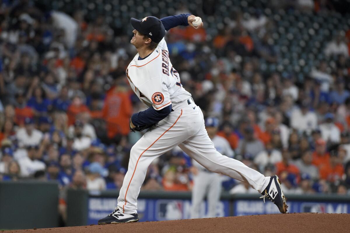Houston Astros starting pitcher Zack Greinke delivers during the first inning.