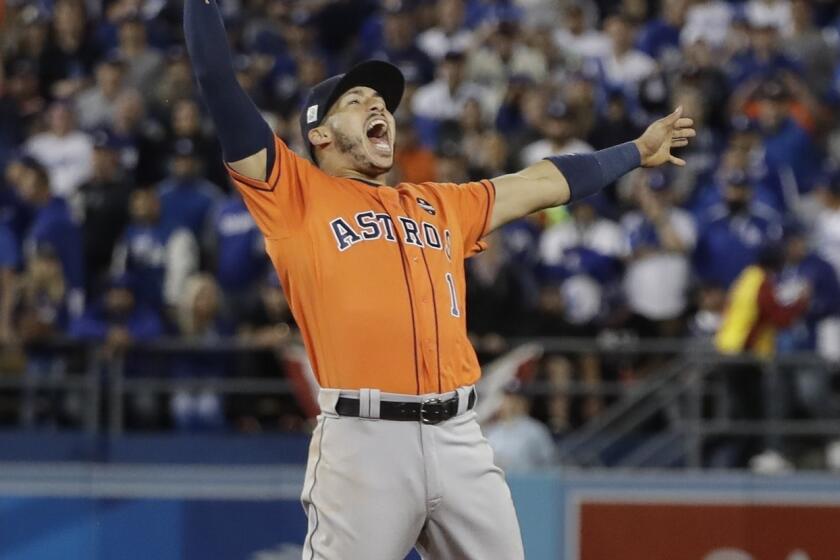 Houston Astros shortstop Carlos Correa celebrates after the Astros defeated the Los Angeles Dodgers to win the 2017 World Series.