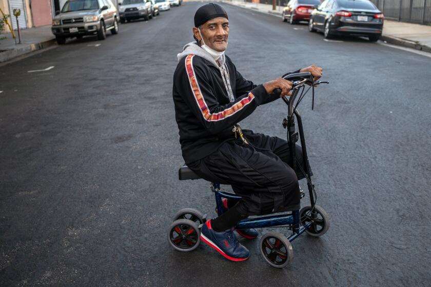 Los Angeles, CA - September 27: Portrait of Marvin Danzey, III, 58, outside the Lincoln Hotel on Wednesday, Sept. 27, 2023, in Los Angeles, CA. Marvin Danzey is a former tenant of the Dewey Hotel. Danzey has significant mobility issues. He left his dentures and most of the rest of his belongings at the Dewey. He was not allowed to go back into the Dewey to pick up his belongings. He was transferred to the Lincoln from the Vagabond less than a month ago. (Francine Orr / Los Angeles Times)
