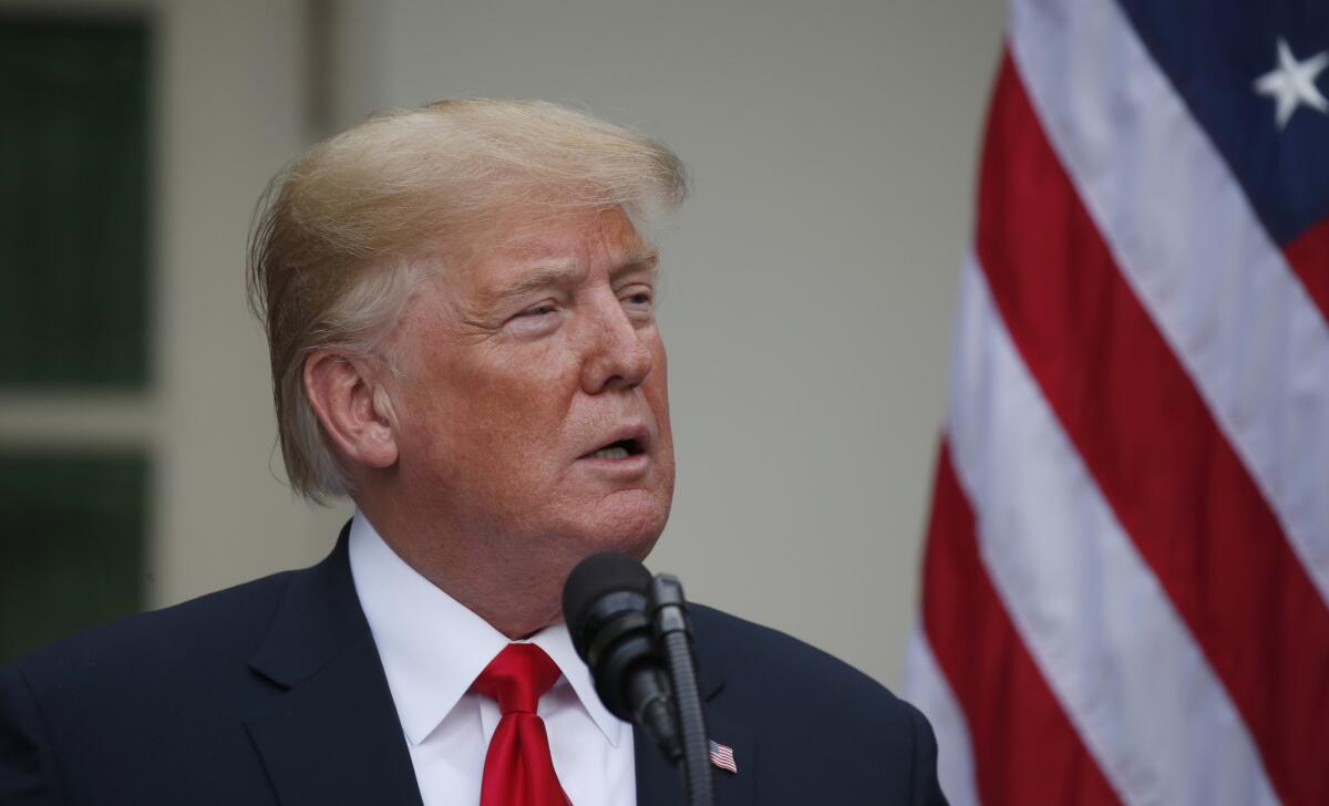 President Donald Trump speaks in the Rose Garden of the White House, accompanied by European Commission president Jean-Claude Juncker, on Wednesday.