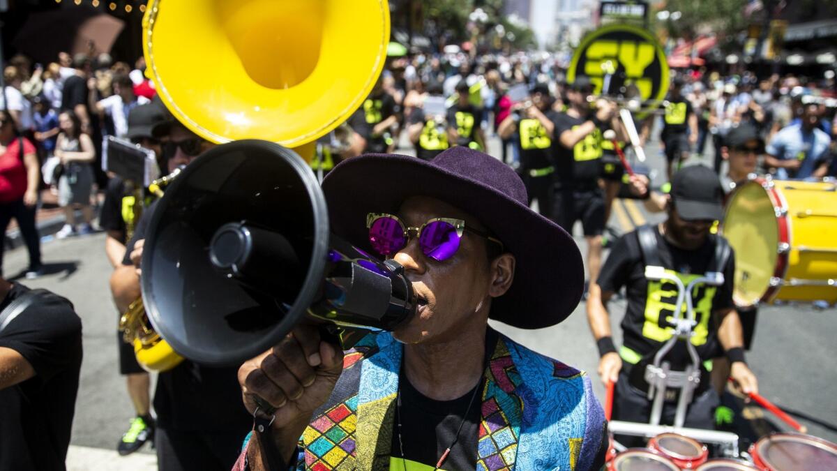 Actor Orlando Jones leads SyFy Marching Band down 5th Avenue in the Gaslamp Quarter on the first day of Comic-Con.