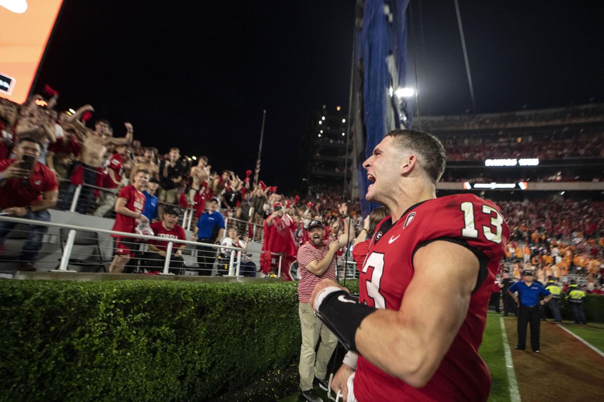 Georgia's Stetson Bennett yells to the crowd as he leaves the field after the Bulldogs' win over Tennessee on Nov. 5, 2022.