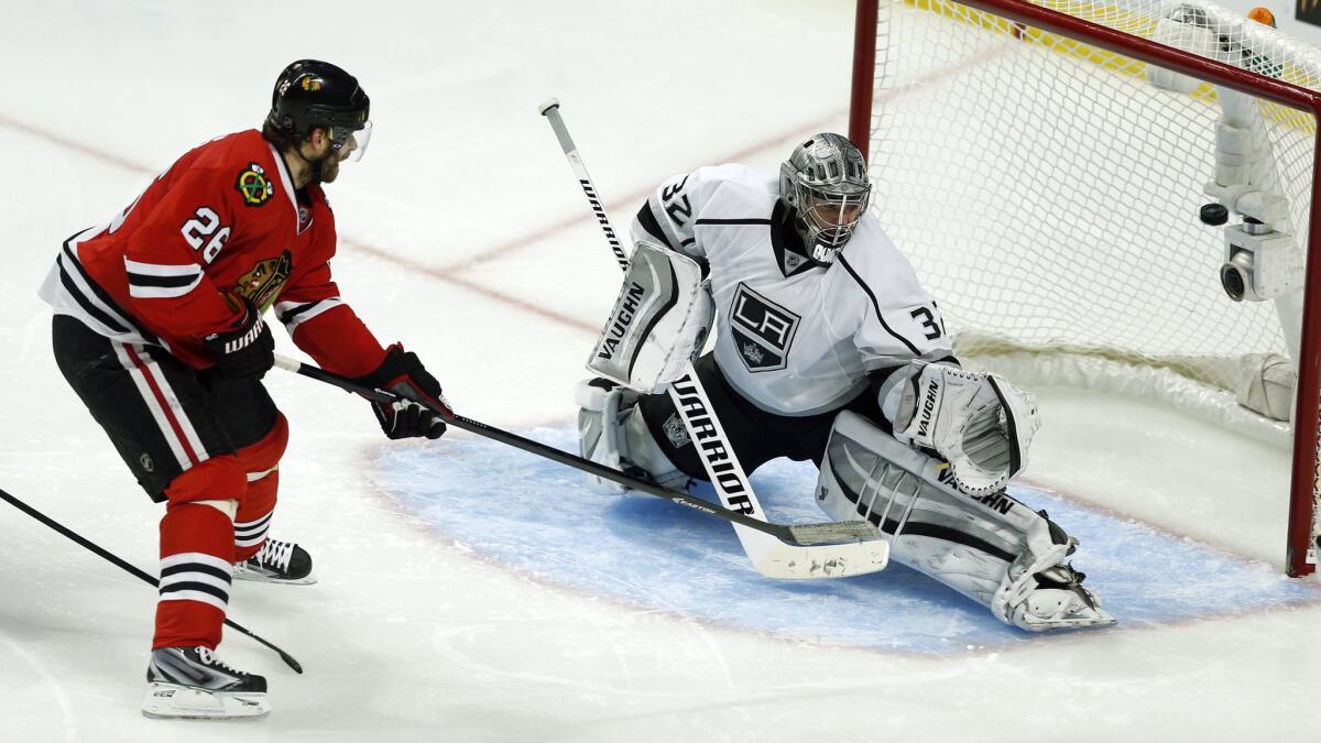 Chicago Blackhawks forward Michal Handzus scores the winning goal past Kings goalie Jonathan Quick in double overtime of the Kings' 5-4 loss in Game 5 of the Western Conference finals Wednesday.