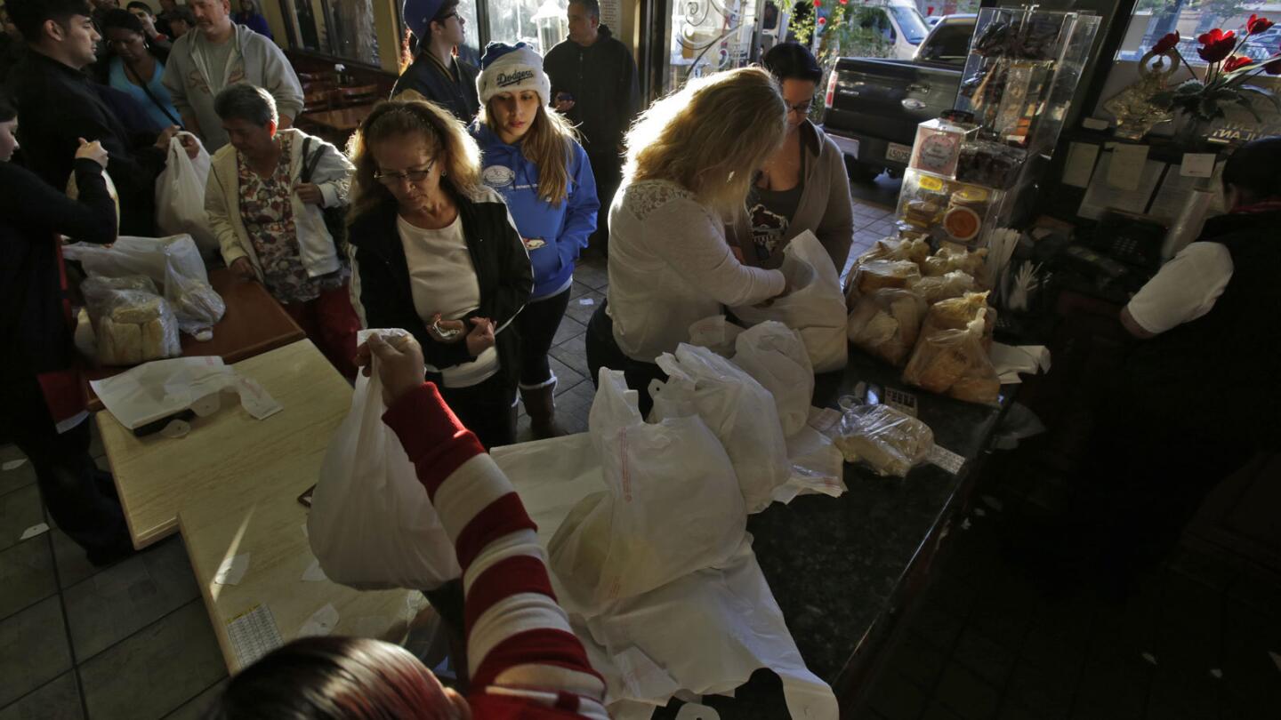 Customers line up early for tamales on Christmas Eve at Tamales Lilianas in East Los Angeles.