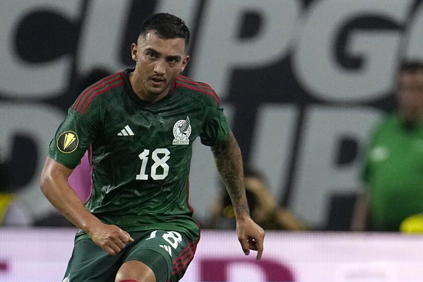 Mexico's Luis Chávez runs up the field during the first half of a CONCACAF Gold Cup soccer match against Honduras Sunday, June 25, 2023, in Houston. (AP Photo/David J. Phillip)