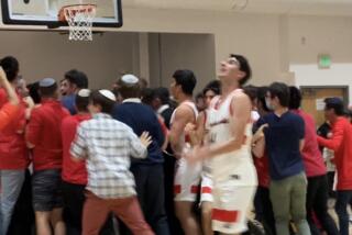 Shalhevet students and players celebrate from a win last month. The team won the 3-A regional title on Monday.