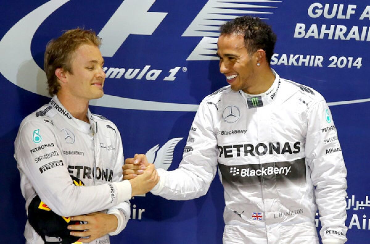 Mercedes teammates Lewis Hamilton, right, and Nico Rosberg celebrate on the podium after finishing one-two in the Bahrain Grand Prix on Sunday.