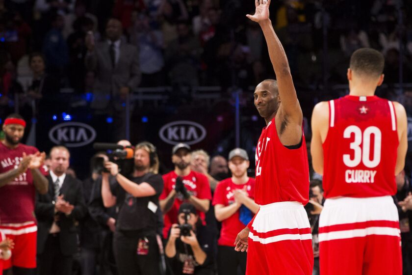 Lakers guard Kobe Bryant acknowledges the crowd as he exits his final NBA All-Star game in the fourth quarter Sunday.