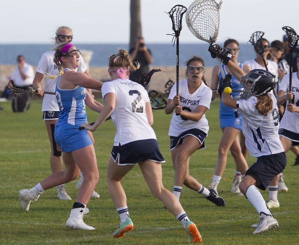 Corona del Mar High's Jensen Coop, far left, takes a shot in traffic during the Battle of the Bay.