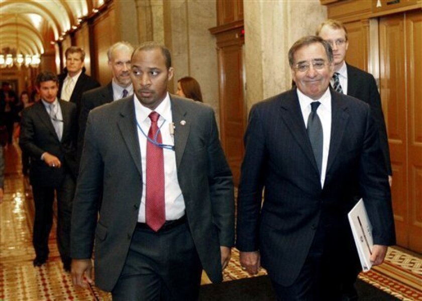 CIA Director Leon Panetta, right, leaves after briefing members of Congress on Capitol Hill Tuesday, May 3, 2011 in Washington.(AP Photo/Alex Brandon)