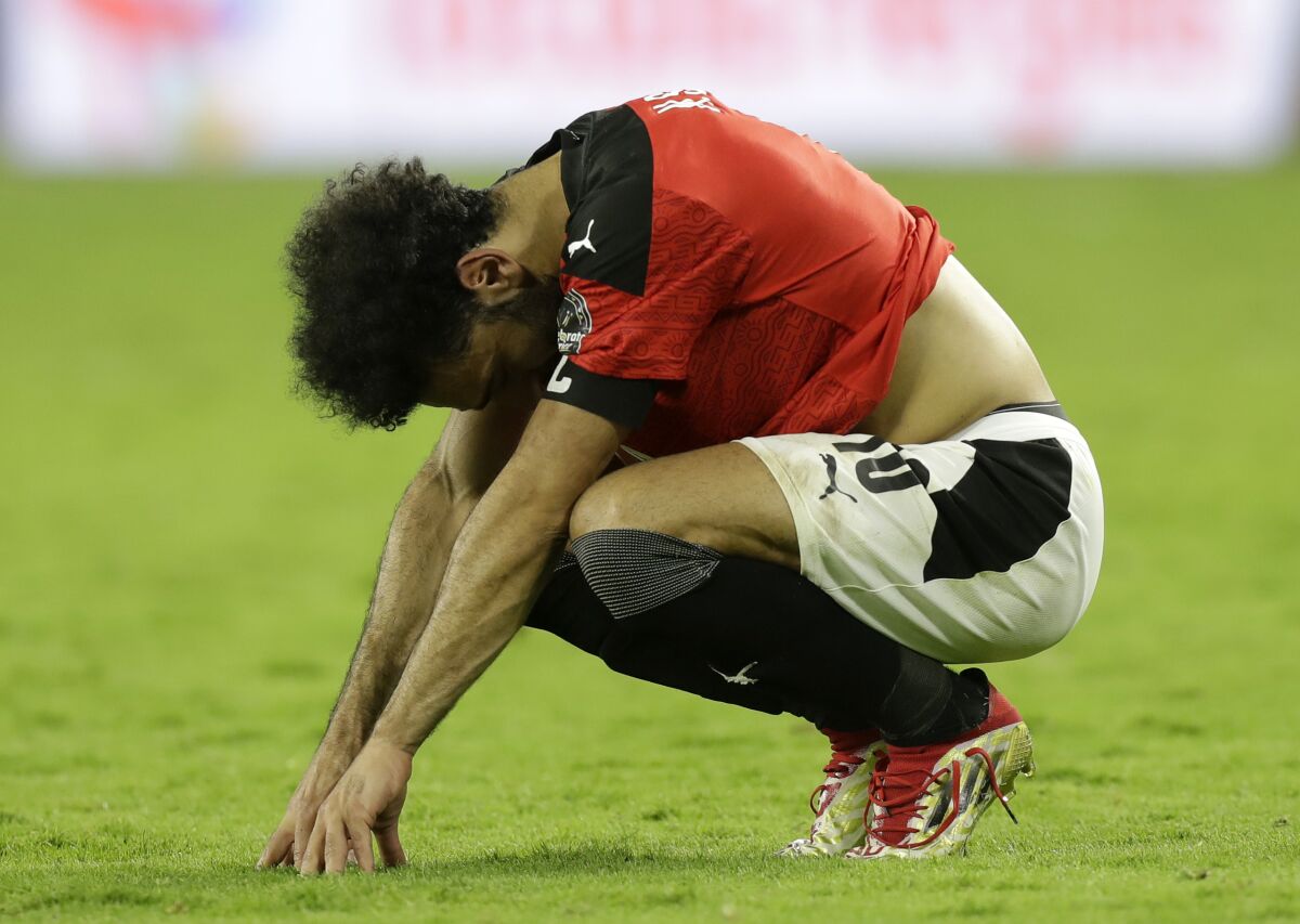 Egypt's Mohamed Salah reacts after the African Cup of Nations 2022 final soccer match between Senegal and Egypt at the Ahmadou Ahidjo stadium in Yaounde, Cameroon, Sunday, Feb. 6, 2022. (AP Photo/Sunday Alamba)