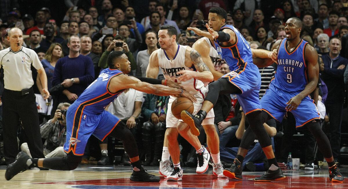 Oklahoma City's Russell Westbrook, left, steals the ball from the Clippers' J.J. Redick on Monday night.