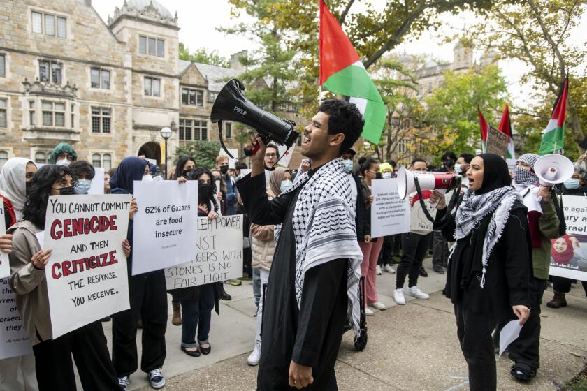 FILE - Pro-Palestinian demonstrators gather to protest University of Michigan President Santa Ono's "Statement regarding Mideast violence" outside the University of Michigan President's House, Oct. 13, 2023, in Ann Arbor, Mich. The University of Michigan failed to assess whether protests and other incidents on campus in response to the Israel-Hamas war created a hostile environment for students, staff and faculty. That's according to the results of an U.S. Education Department investigation announced Monday. (Jacob Hamilton/Ann Arbor News via AP, File)