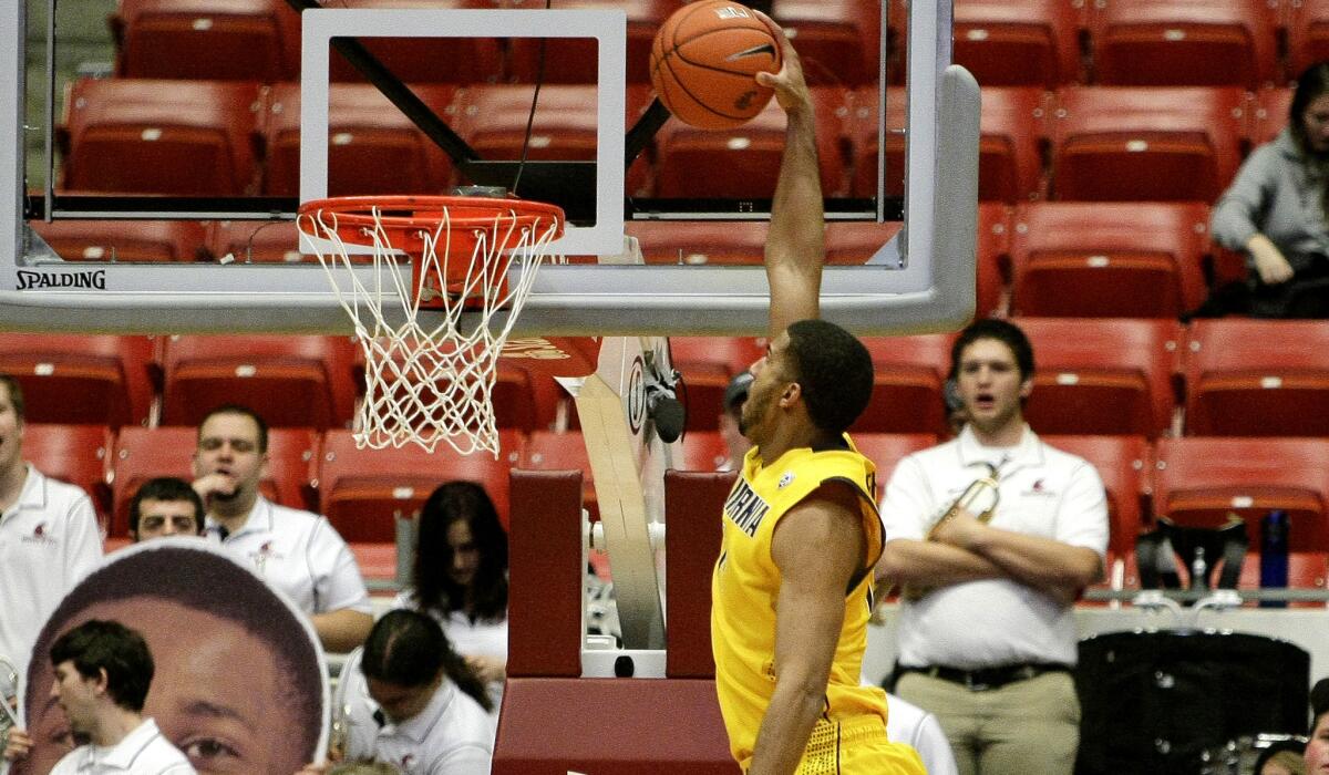 California forward Christain Behrens goes up for dunk against Washington in the second half Thursday night.