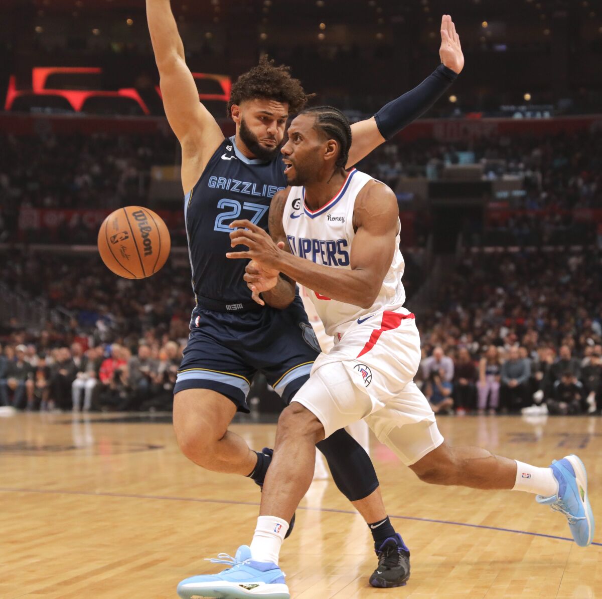 Clippers star Kawhi Leonard is fouled by Grizzlies' David Roddy in the second quarter on Sunday.