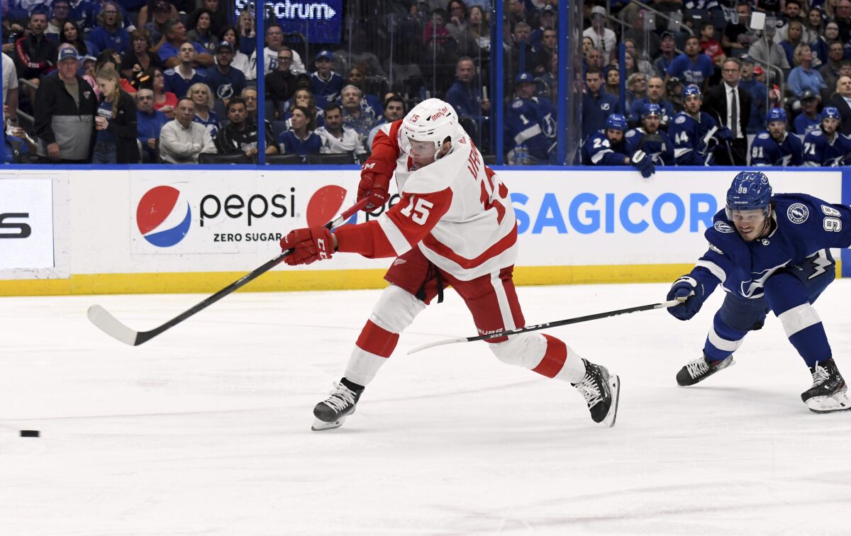 Detroit Red Wings left wing Jakub Vrana (15) scores during the third period an NHL hockey game against the Tampa Bay Lightning Tuesday, April 19, 2022, in Tampa, Fla. (AP Photo/Jason Behnken)