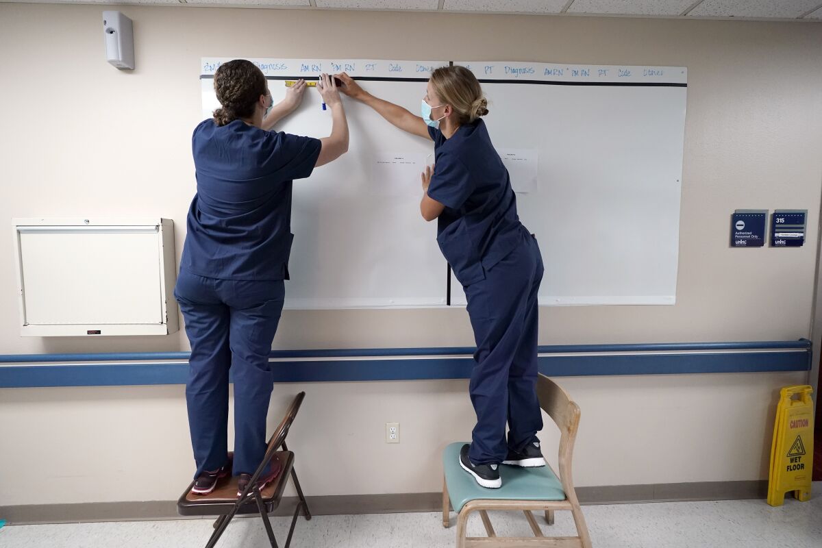 Nurses set up a patient board