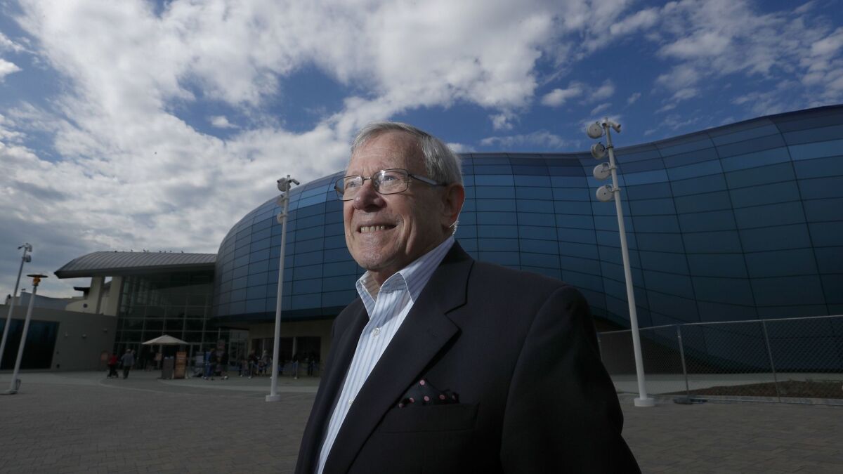 Jerry Schubel, the president and CEO of the Aquarium of the Pacific, stands in front of the aquarium's new 29,000-square-foot wing in Long Beach.