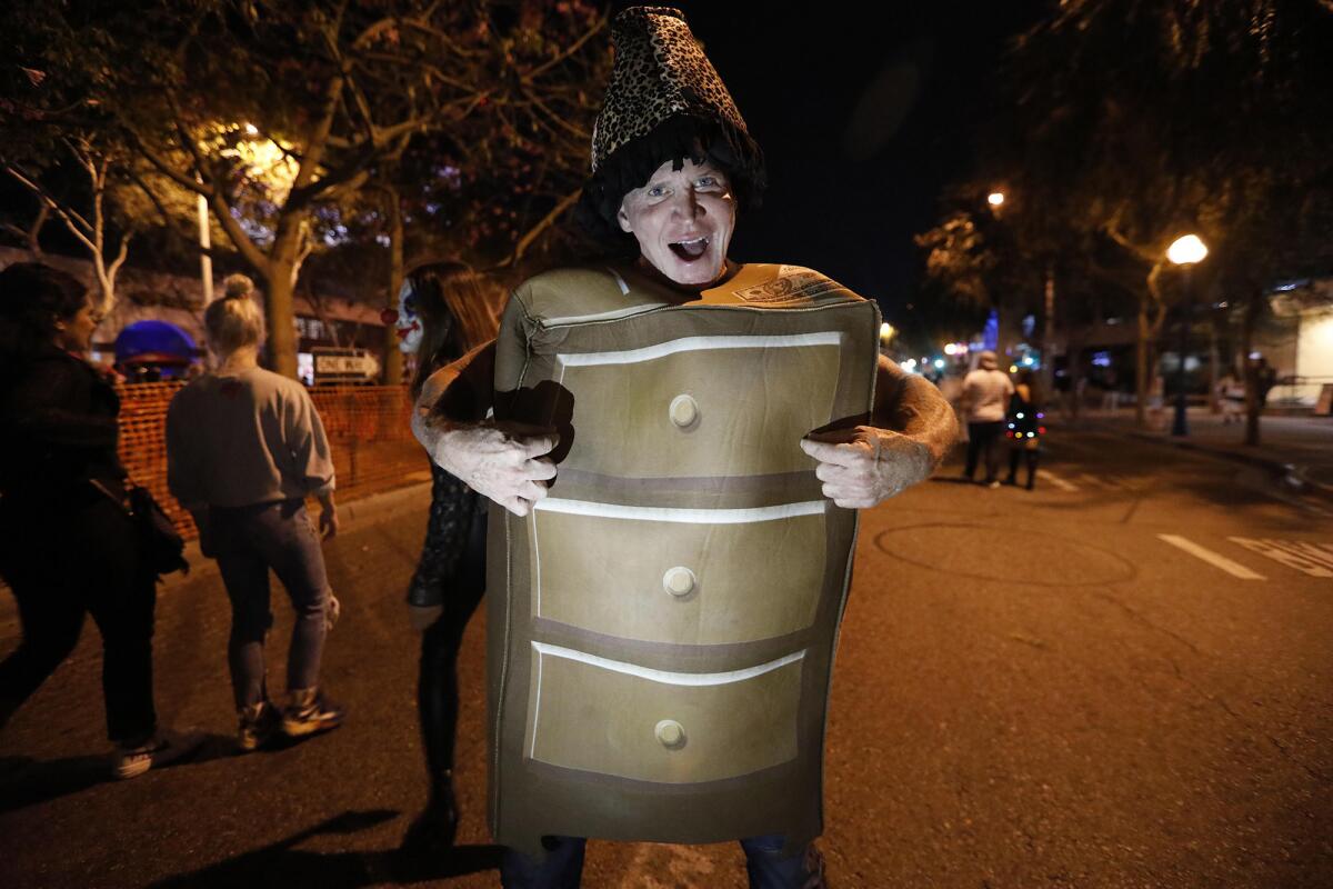 Mike Cline, dressed as a One Night Stand, joins the thousands of costumed revelers at the annual Halloween Carnaval..