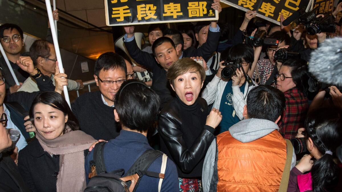 Activist Tanya Chan, center, before her arrest in Hong Kong on March 27, 2017.