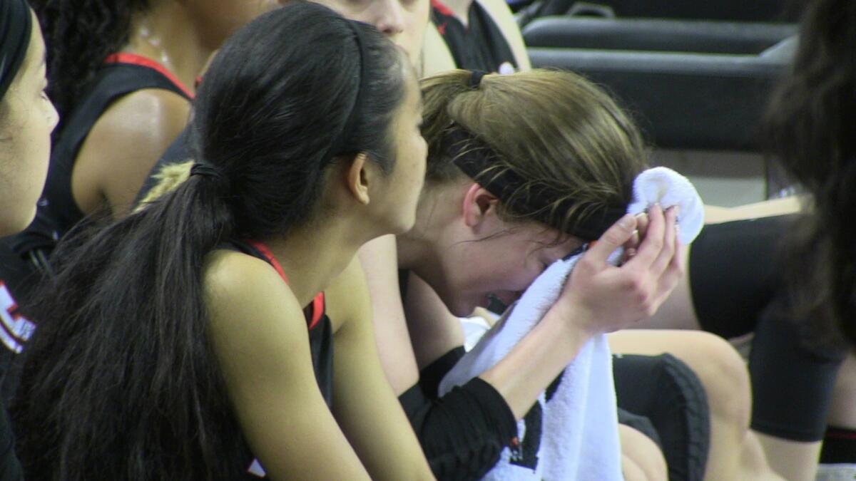 Village Christian players show disappointment after falling in state Division V final on Thursday at Sleep Train Arena.