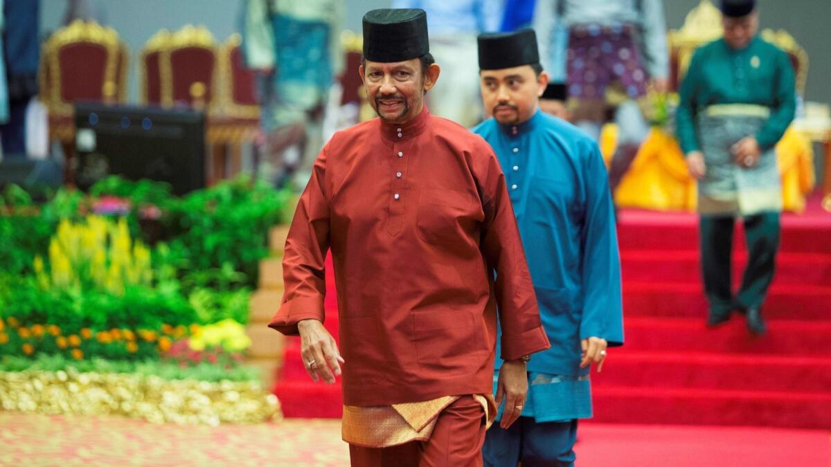 Brunei's Sultan Hassanal Bolkiah leaves after speaking at an event in Bandar Seri Begawan on April 3.